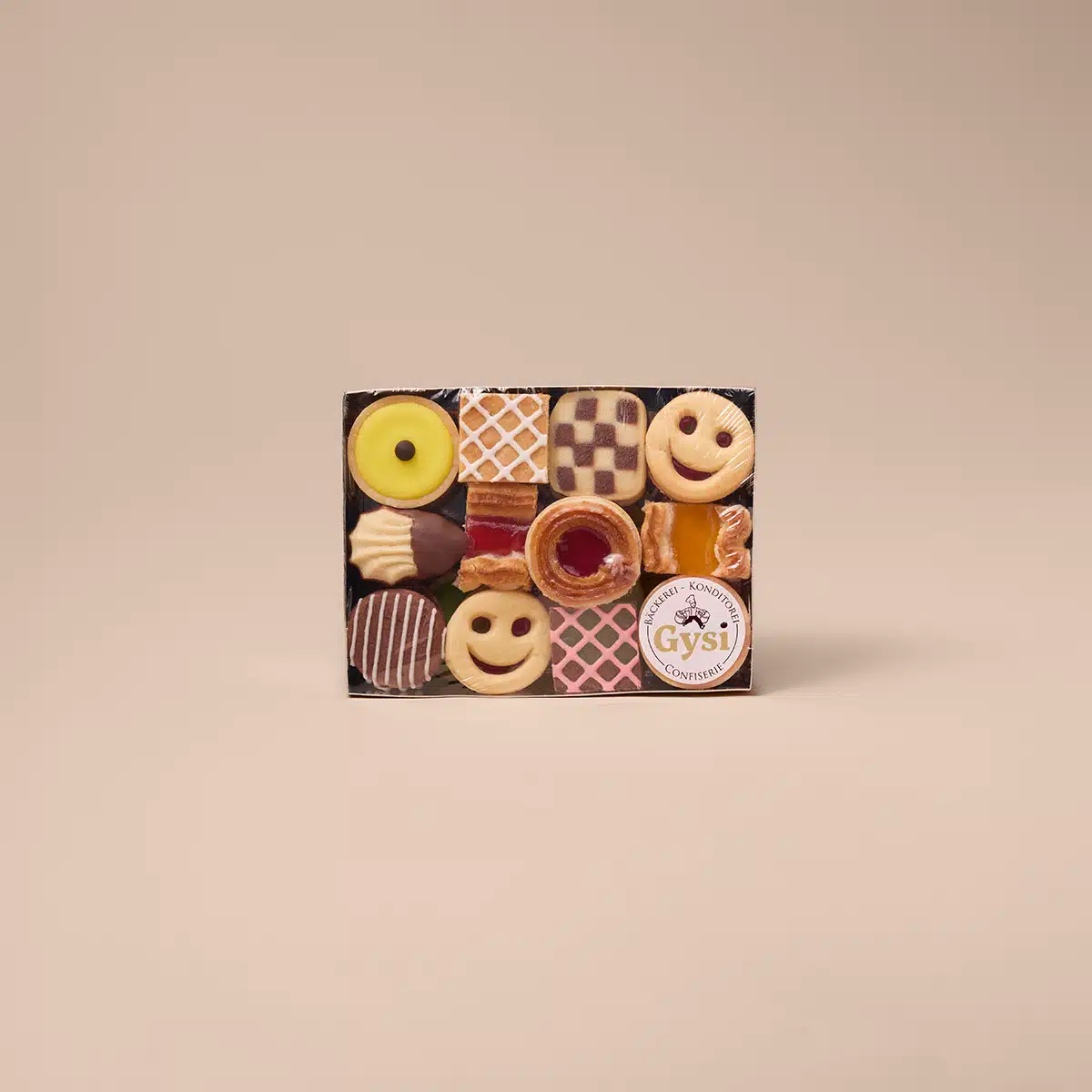 12 Sorten Butterkonfekt, verpackt in der Goldschale